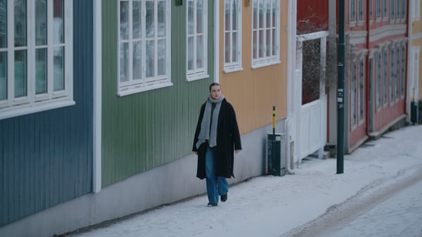 Woman walking in the winter streets of Oslo