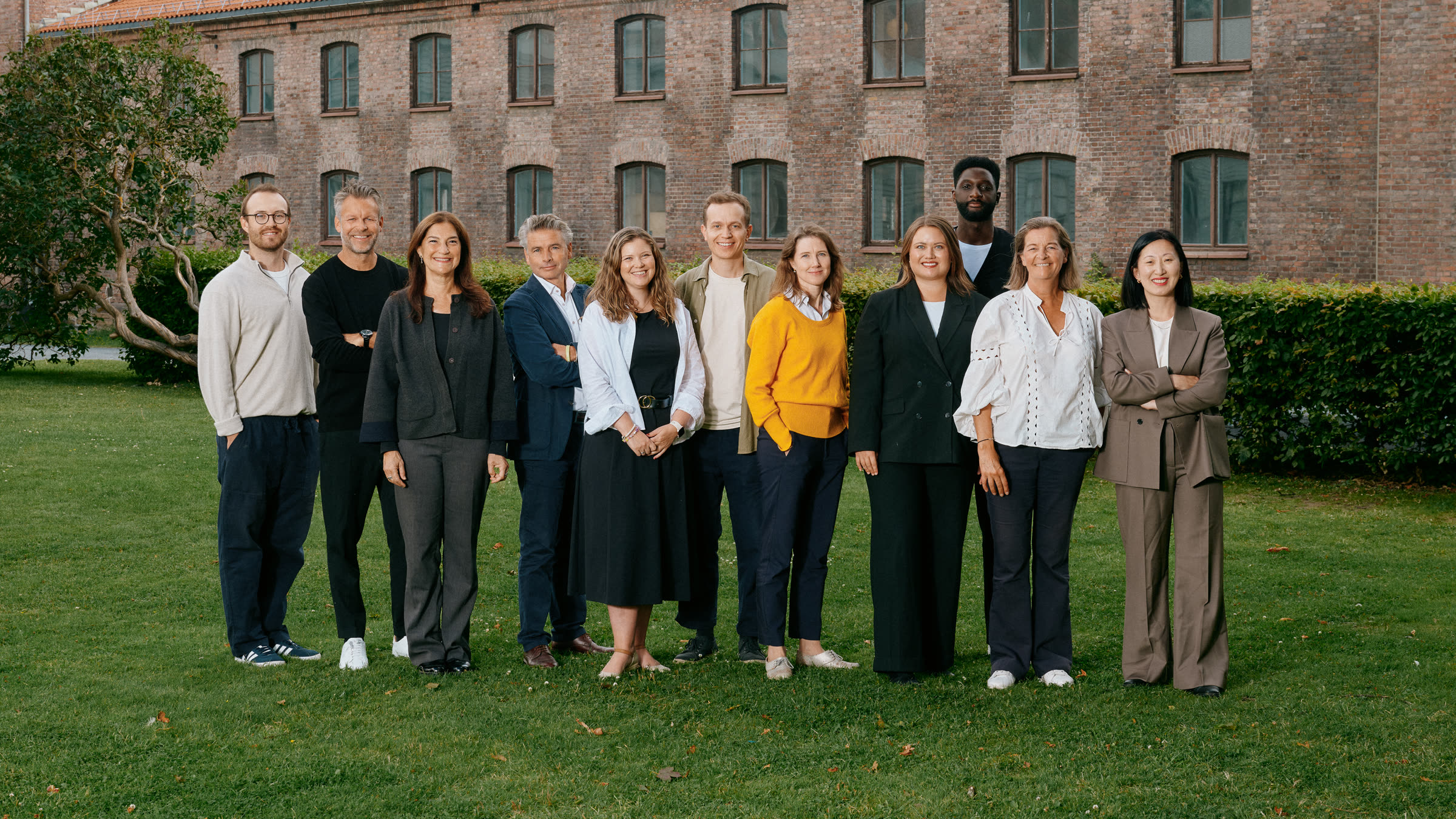 The Oslo&Co team together on the lawn outside the office
