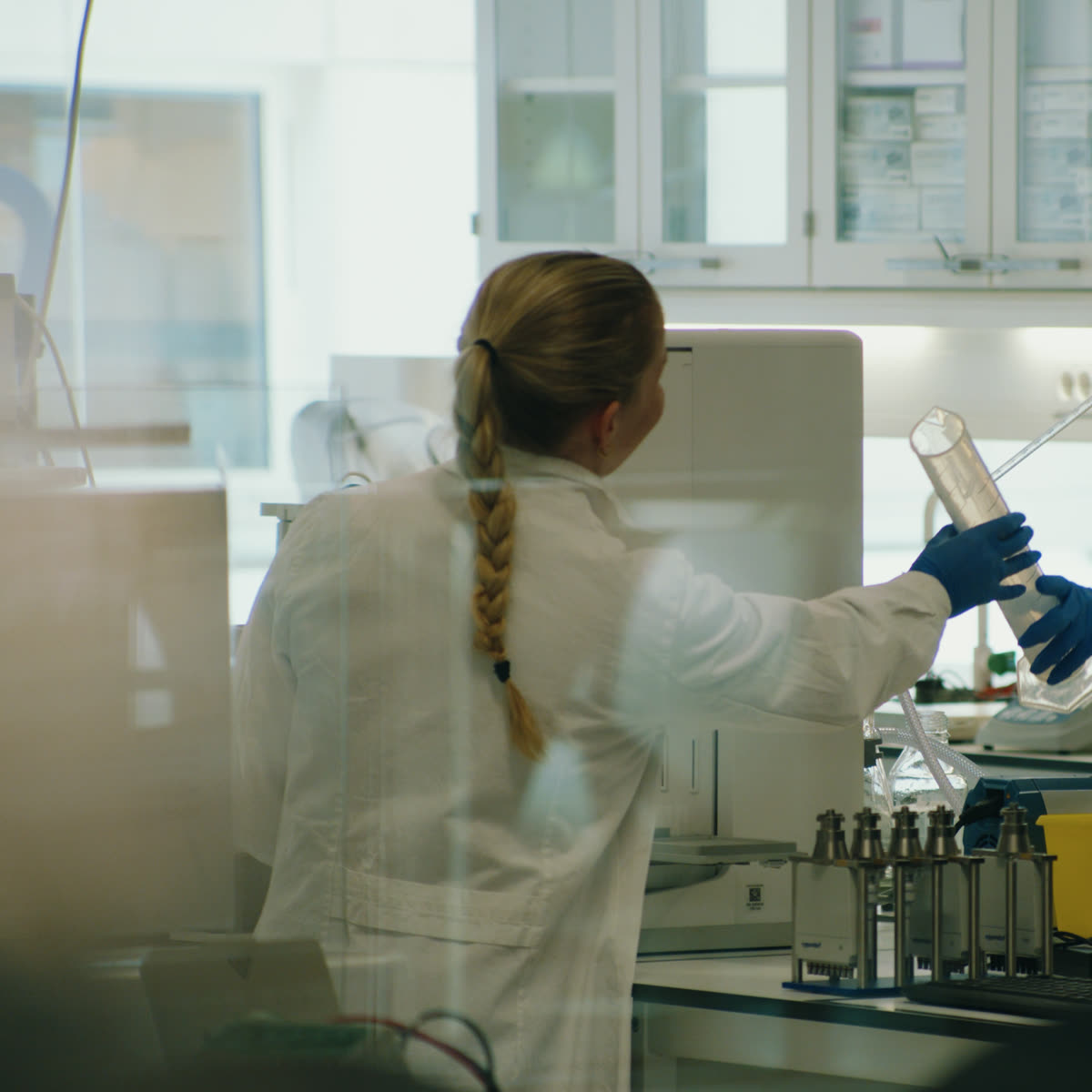 A researcher handling samples in a laboratory in Oslo